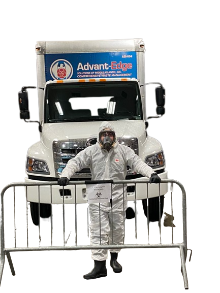 Employee in Hazmat suit and truck Worker in hazmat suit stands by company truck, ready for hazardous waste disposal to ensure safety and compliance.