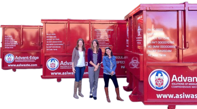 ASMAI Management with roll off dumpsters Image of 3 women from the ASMAI management team posed in front of our roll off dumpsters