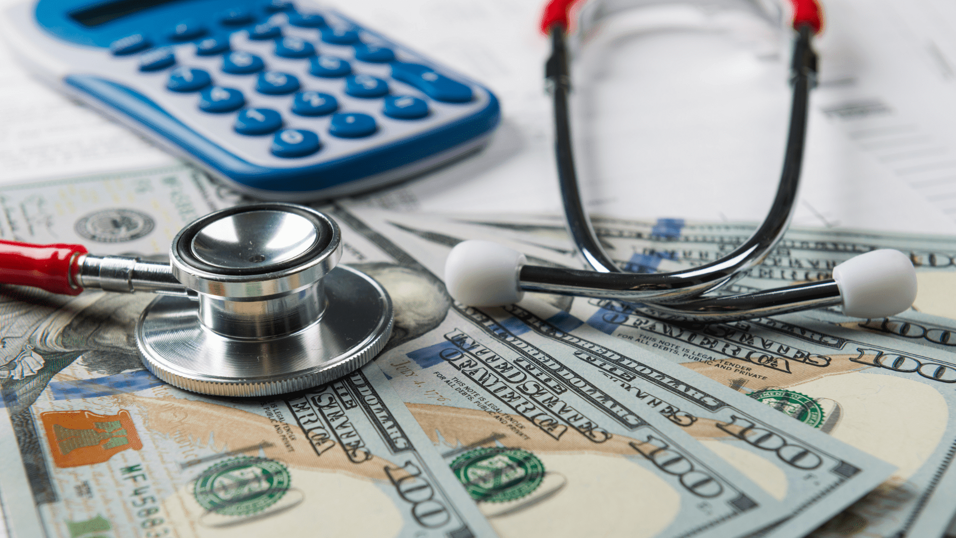Stethoscope and calculator on cash, symbolizing rising medical waste disposal cost in healthcare.