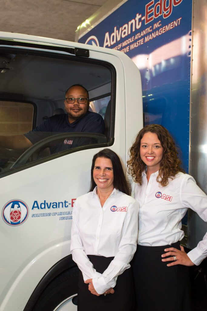 image of ASMAI employees posing with custom truck