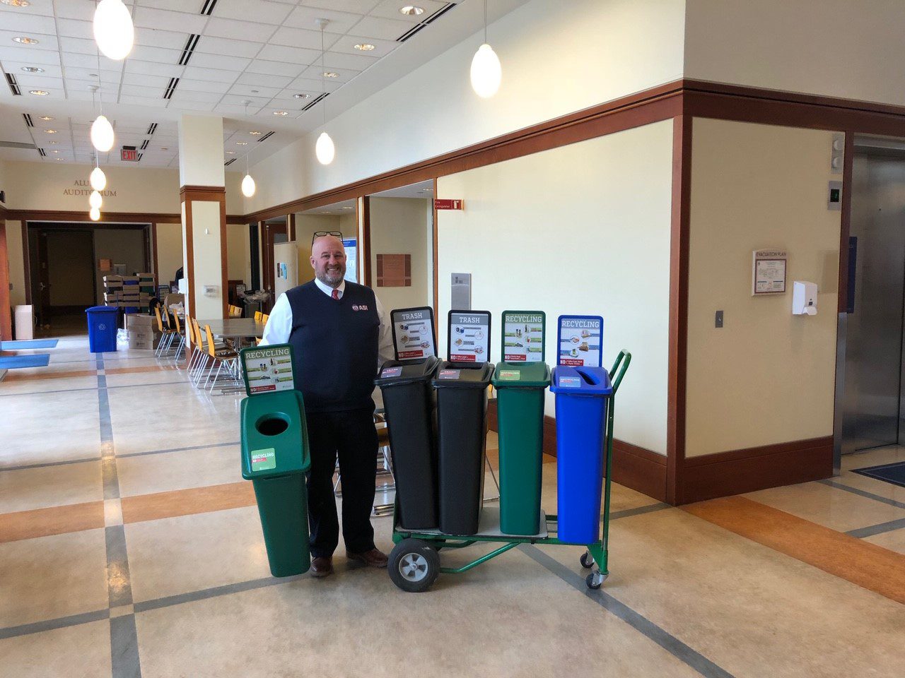 Image of ASMAI vice president with waste sorting stations